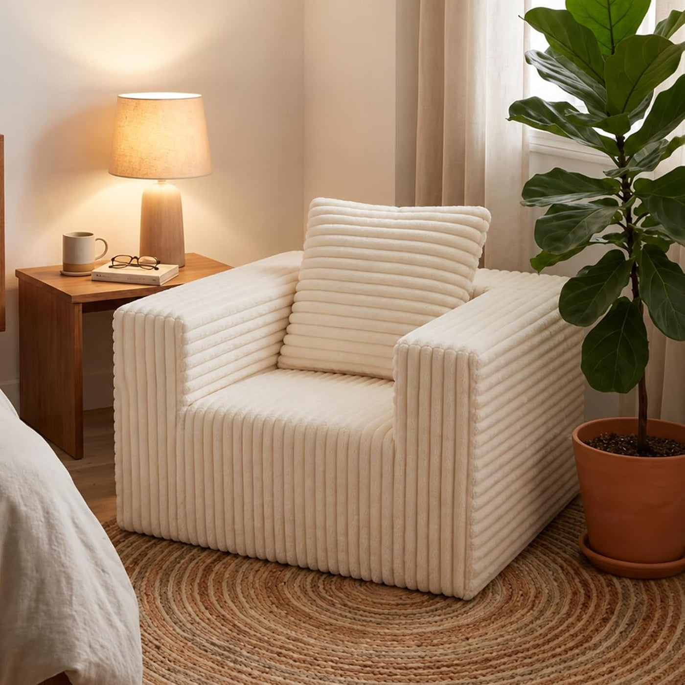 Boneless corduroy cloud chair beside a bed